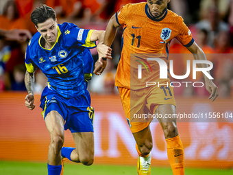 Bosnia and Herzegovina midfielder Denis Huseinbasic and Netherlands forward Cody Gakpo during the match between the Netherlands and Bosnia a...