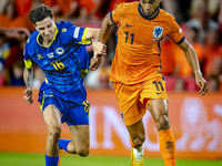 Bosnia and Herzegovina midfielder Denis Huseinbasic and Netherlands forward Cody Gakpo during the match between the Netherlands and Bosnia a...