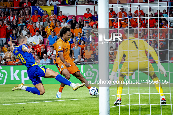 Bosnia and Herzegovina defender Nikola Katic and Netherlands forward Joshua Zirkzee during the match between the Netherlands and Bosnia and...