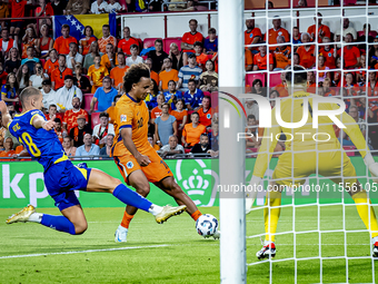 Bosnia and Herzegovina defender Nikola Katic and Netherlands forward Joshua Zirkzee during the match between the Netherlands and Bosnia and...