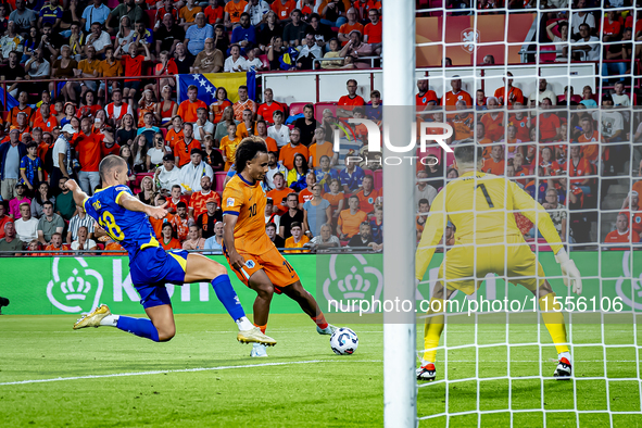 Bosnia and Herzegovina defender Nikola Katic and Netherlands forward Joshua Zirkzee during the match between the Netherlands and Bosnia and...