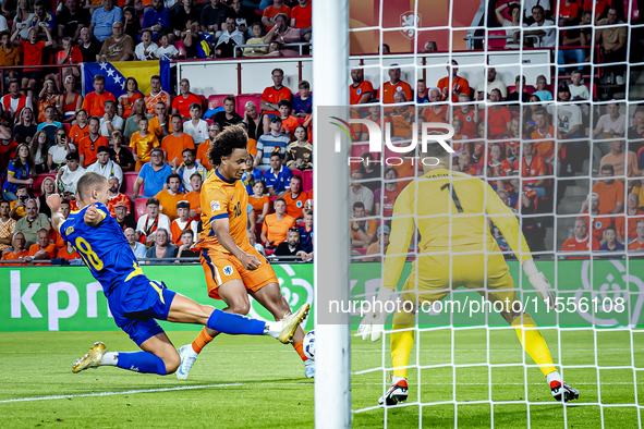 Bosnia and Herzegovina defender Nikola Katic and Netherlands forward Joshua Zirkzee during the match between the Netherlands and Bosnia and...