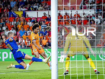 Bosnia and Herzegovina defender Nikola Katic and Netherlands forward Joshua Zirkzee during the match between the Netherlands and Bosnia and...