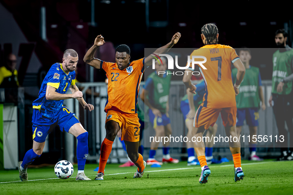 Bosnia and Herzegovina defender Nihad Mujakic and Netherlands defender Denzel Dumfries during the match between the Netherlands and Bosnia a...