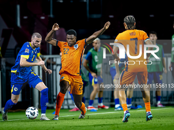 Bosnia and Herzegovina defender Nihad Mujakic and Netherlands defender Denzel Dumfries during the match between the Netherlands and Bosnia a...