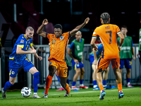 Bosnia and Herzegovina defender Nihad Mujakic and Netherlands defender Denzel Dumfries during the match between the Netherlands and Bosnia a...