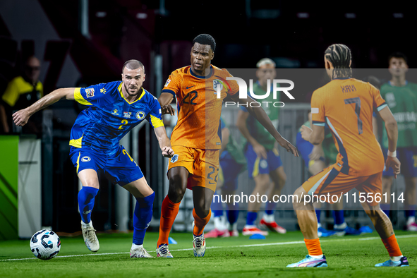 Bosnia and Herzegovina defender Nihad Mujakic and Netherlands defender Denzel Dumfries during the match between the Netherlands and Bosnia a...