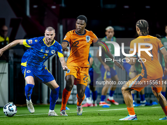 Bosnia and Herzegovina defender Nihad Mujakic and Netherlands defender Denzel Dumfries during the match between the Netherlands and Bosnia a...