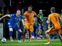 Bosnia and Herzegovina defender Nihad Mujakic and Netherlands defender Denzel Dumfries during the match between the Netherlands and Bosnia a...