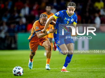 Netherlands midfielder Xavi Simons and Bosnia and Herzegovina defender Amar Dedic during the match between the Netherlands and Bosnia and He...