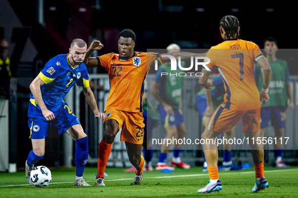 Bosnia and Herzegovina defender Nihad Mujakic and Netherlands defender Denzel Dumfries during the match between the Netherlands and Bosnia a...