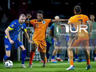 Bosnia and Herzegovina defender Nihad Mujakic and Netherlands defender Denzel Dumfries during the match between the Netherlands and Bosnia a...