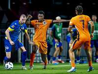 Bosnia and Herzegovina defender Nihad Mujakic and Netherlands defender Denzel Dumfries during the match between the Netherlands and Bosnia a...