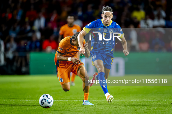 Netherlands midfielder Xavi Simons and Bosnia and Herzegovina defender Amar Dedic during the match between the Netherlands and Bosnia and He...