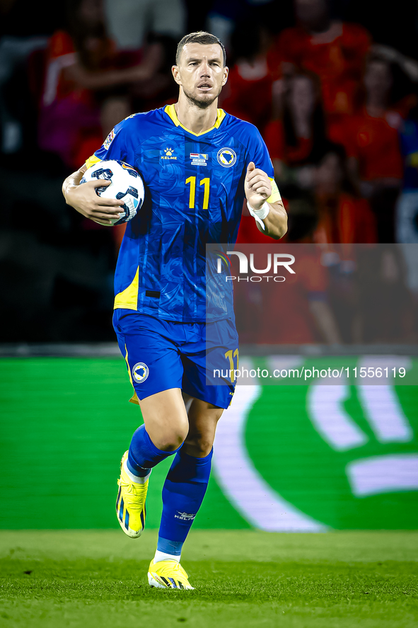 Bosnia and Herzegovina forward Edin Dzeko scores the 3-2 and celebrates the goal during the match between the Netherlands and Bosnia and Her...