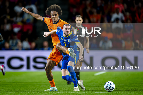 Netherlands forward Joshua Zirkzee and Bosnia and Herzegovina defender Nihad Mujakic during the match between the Netherlands and Bosnia and...