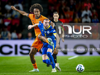 Netherlands forward Joshua Zirkzee and Bosnia and Herzegovina defender Nihad Mujakic during the match between the Netherlands and Bosnia and...