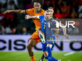 Netherlands forward Joshua Zirkzee and Bosnia and Herzegovina defender Nihad Mujakic during the match between the Netherlands and Bosnia and...