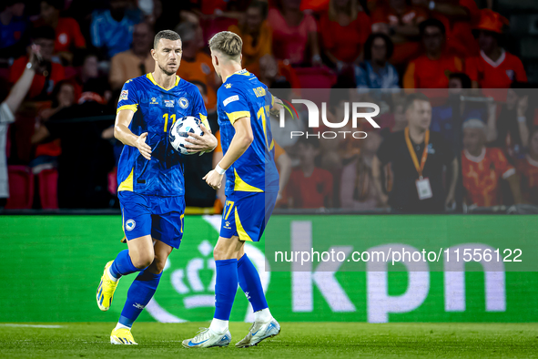 Bosnia and Herzegovina forward Edin Dzeko scores the 3-2 and celebrates the goal during the match between the Netherlands and Bosnia and Her...