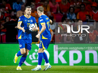 Bosnia and Herzegovina forward Edin Dzeko scores the 3-2 and celebrates the goal during the match between the Netherlands and Bosnia and Her...