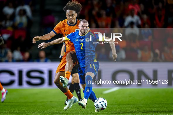 Netherlands forward Joshua Zirkzee and Bosnia and Herzegovina defender Nihad Mujakic during the match between the Netherlands and Bosnia and...