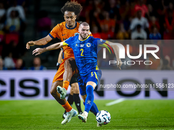 Netherlands forward Joshua Zirkzee and Bosnia and Herzegovina defender Nihad Mujakic during the match between the Netherlands and Bosnia and...