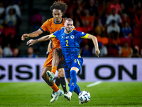 Netherlands forward Joshua Zirkzee and Bosnia and Herzegovina defender Nihad Mujakic during the match between the Netherlands and Bosnia and...