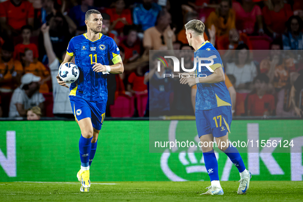 Bosnia and Herzegovina forward Edin Dzeko scores the 3-2 and celebrates the goal during the match between the Netherlands and Bosnia and Her...