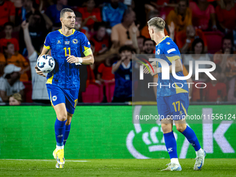 Bosnia and Herzegovina forward Edin Dzeko scores the 3-2 and celebrates the goal during the match between the Netherlands and Bosnia and Her...