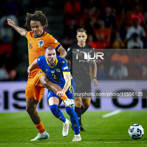 Netherlands forward Joshua Zirkzee and Bosnia and Herzegovina defender Nihad Mujakic during the match between the Netherlands and Bosnia and...