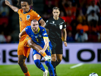 Netherlands forward Joshua Zirkzee and Bosnia and Herzegovina defender Nihad Mujakic during the match between the Netherlands and Bosnia and...