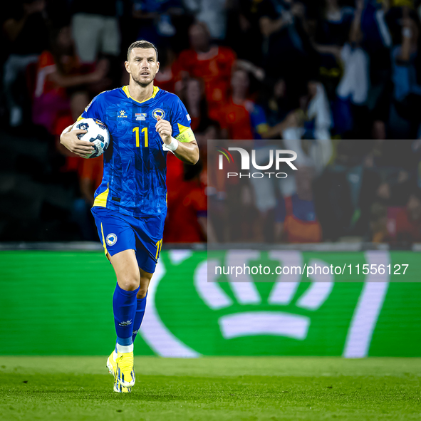 Bosnia and Herzegovina forward Edin Dzeko scores the 3-2 and celebrates the goal during the match between the Netherlands and Bosnia and Her...