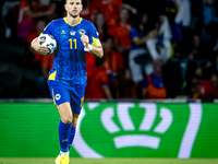 Bosnia and Herzegovina forward Edin Dzeko scores the 3-2 and celebrates the goal during the match between the Netherlands and Bosnia and Her...