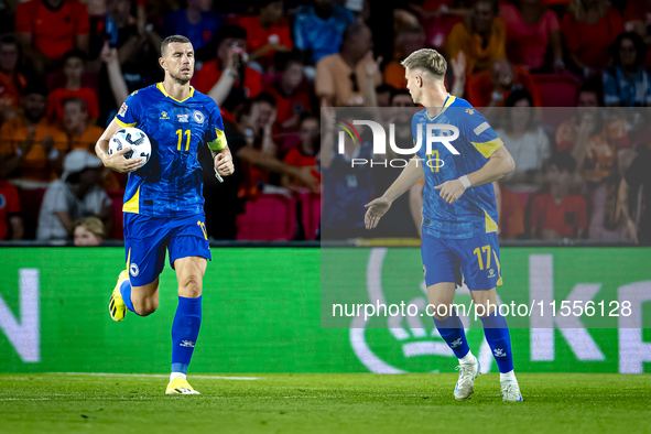 Bosnia and Herzegovina forward Edin Dzeko scores the 3-2 and celebrates the goal during the match between the Netherlands and Bosnia and Her...