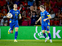 Bosnia and Herzegovina forward Edin Dzeko scores the 3-2 and celebrates the goal during the match between the Netherlands and Bosnia and Her...