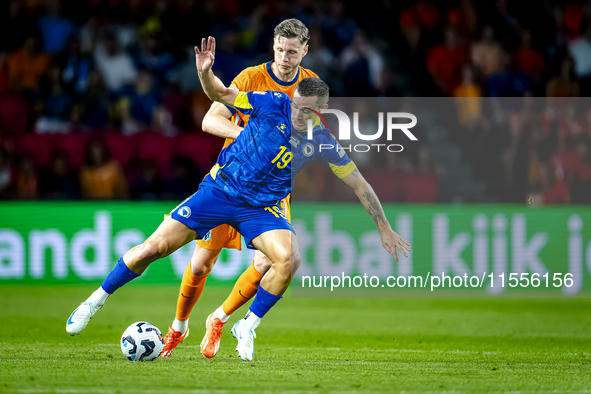 Bosnia and Herzegovina forward Ermedin Demirovic and Netherlands forward Wout Weghorst during the match between the Netherlands and Bosnia a...