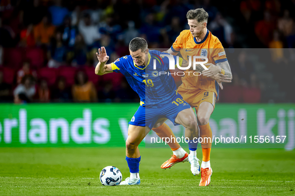 Bosnia and Herzegovina forward Ermedin Demirovic and Netherlands forward Wout Weghorst during the match between the Netherlands and Bosnia a...