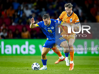 Bosnia and Herzegovina forward Ermedin Demirovic and Netherlands forward Wout Weghorst during the match between the Netherlands and Bosnia a...