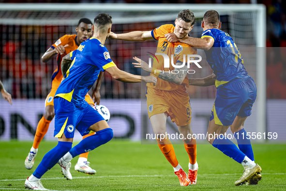 Netherlands forward Wout Weghorst and Bosnia and Herzegovina defender Nikola Katic during the match between the Netherlands and Bosnia and H...