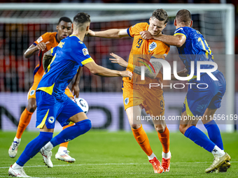 Netherlands forward Wout Weghorst and Bosnia and Herzegovina defender Nikola Katic during the match between the Netherlands and Bosnia and H...