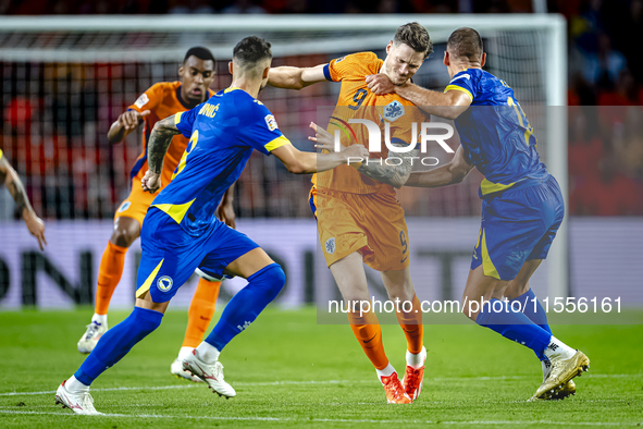 Netherlands forward Wout Weghorst and Bosnia and Herzegovina defender Nikola Katic during the match between the Netherlands and Bosnia and H...