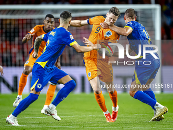 Netherlands forward Wout Weghorst and Bosnia and Herzegovina defender Nikola Katic during the match between the Netherlands and Bosnia and H...