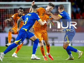 Netherlands forward Wout Weghorst and Bosnia and Herzegovina defender Nikola Katic during the match between the Netherlands and Bosnia and H...