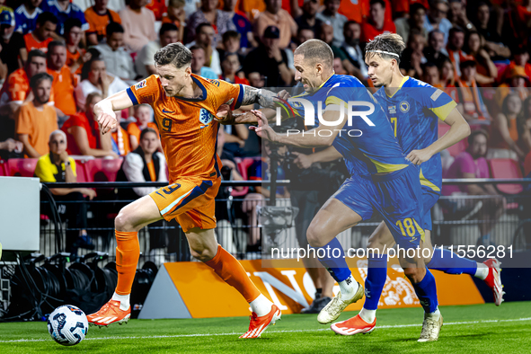 Netherlands forward Wout Weghorst and Bosnia and Herzegovina defender Nikola Katic during the match between the Netherlands and Bosnia and H...