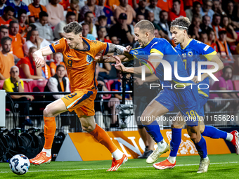 Netherlands forward Wout Weghorst and Bosnia and Herzegovina defender Nikola Katic during the match between the Netherlands and Bosnia and H...