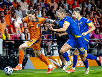 Netherlands forward Wout Weghorst and Bosnia and Herzegovina defender Nikola Katic during the match between the Netherlands and Bosnia and H...