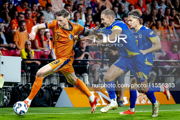 Netherlands forward Wout Weghorst and Bosnia and Herzegovina defender Nikola Katic during the match between the Netherlands and Bosnia and H...