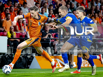 Netherlands forward Wout Weghorst and Bosnia and Herzegovina defender Nikola Katic during the match between the Netherlands and Bosnia and H...