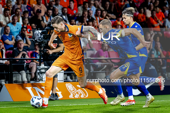 Netherlands forward Wout Weghorst and Bosnia and Herzegovina defender Nikola Katic during the match between the Netherlands and Bosnia and H...