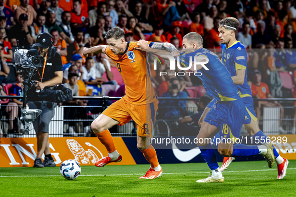 Netherlands forward Wout Weghorst and Bosnia and Herzegovina defender Nikola Katic during the match between the Netherlands and Bosnia and H...